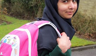 Malala Yousafzai, the Pakistani schoolgirl shot in the head by the Taliban, attends her first post-shooting day of school on Tuesday, March 19, 2013, just weeks after being released from the hospital. The 15-year-old participated in lessons at the Edgbaston High School for Girls in Birmingham, England. (AP Photo/Malala Press Office)

