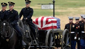 ** FILE ** Marines conduct military funeral services at Arlington cemetery, Dec. 7, 2012. (Associated Press)