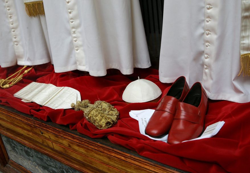 The Gammarelli family, ecclesiastical tailors for centuries, displayed various sizes of papal outfits before Benedict's successor was chosen. The man deemed fit for pope, however, has not worn the red leather loafers.
