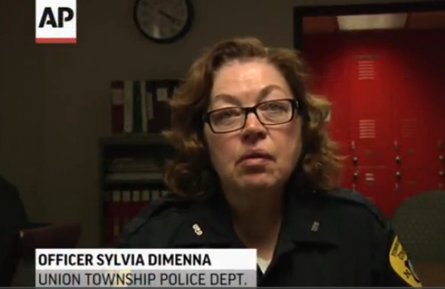Officer Sylvia Dimenna traveled to the hospital and remained there with the boy, 4, who was found near his dead mother. (Associated Press)