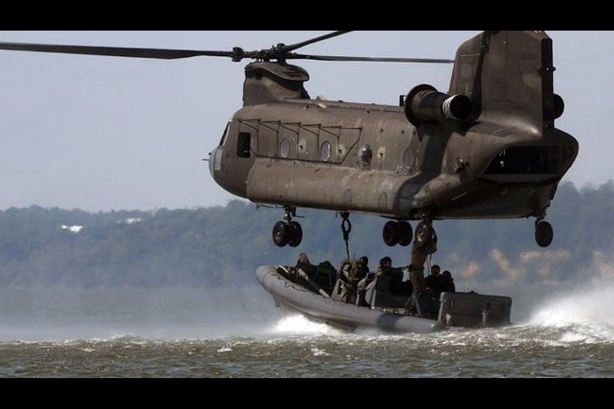 ** FILE ** Navy SEALs conduct training exercises off the coast of Virginia. (Associated Press)
