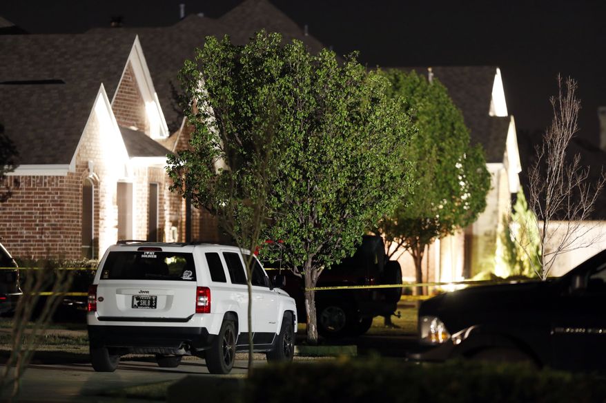 Police caution tape surrounds the home of Kaufman County District Attorney Mike McLelland and his wife, Cynthia McLelland, who were found dead in their home near Forney, Texas, on Saturday, March 30, 2013. (AP Photo/The Dallas Morning News, Ian C. Bates)