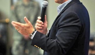Sen. Jeff Flake, Arizona Republican, answers questions from the crowd about immigration reform, gay marriage and other topics on Thursday, March 28, 2013, during a town-hall-style meeting at Embry-Riddle Aeronautical University in Prescott, Ariz. (AP Photo/The Daily Courier, Matt Hinshaw)