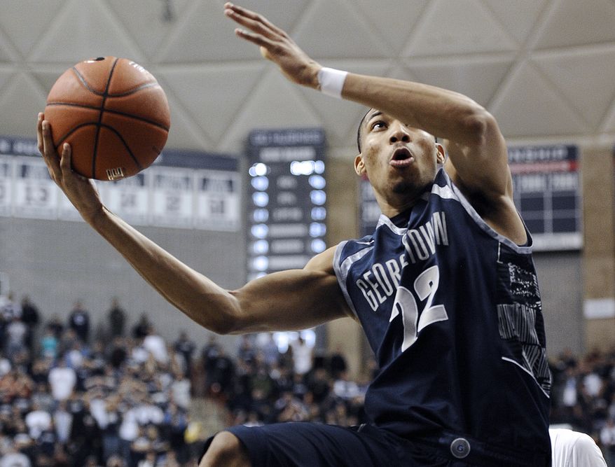 FILE - In this Feb. 27, 2013 file photo, Georgetown's Otto Porter Jr. goes up for the game-winning basket during the second overtime of an NCAA college basketball game against Connecticut in Storrs, Conn. Porter was selected to the AP All-America team Monday, April 1, 2013. (AP Photo/Jessica Hill, File)