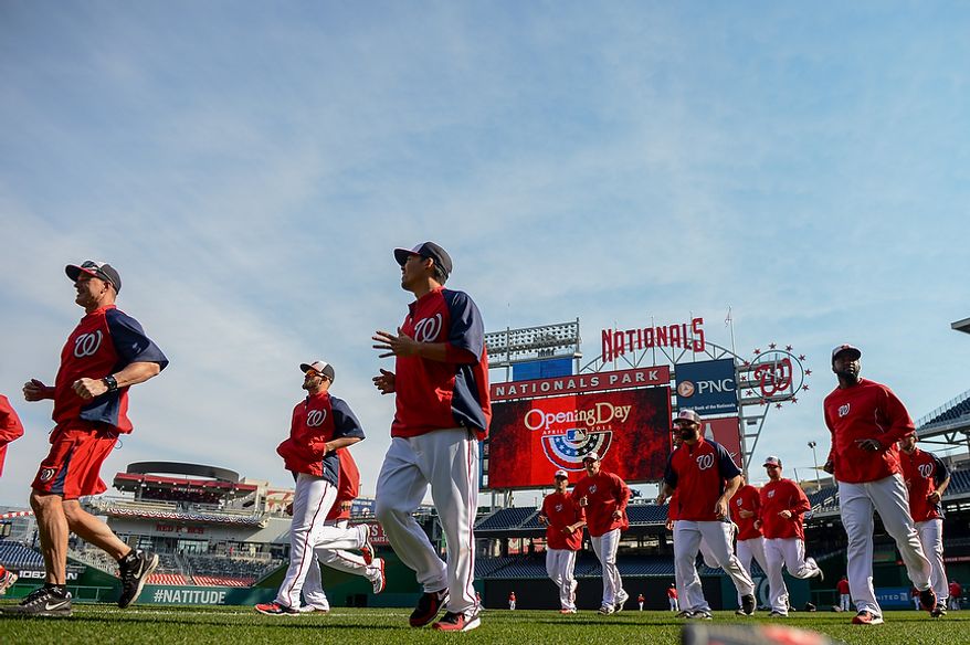 The Washington Nationals warm up before they play the Miami Marlins on opening day at Nationals Park, Washington, D.C., Monday, April 1, 2013. (Andrew Harnik/The Washington Times)