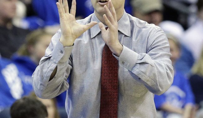 Rutgers head coach Mike Rice reacts to play during the second half of an NCAA college basketball game against Seton Hall, Friday, March 8, 2013, in Newark, N.J. Rutgers won 56-51. (AP Photo/Mel Evans)