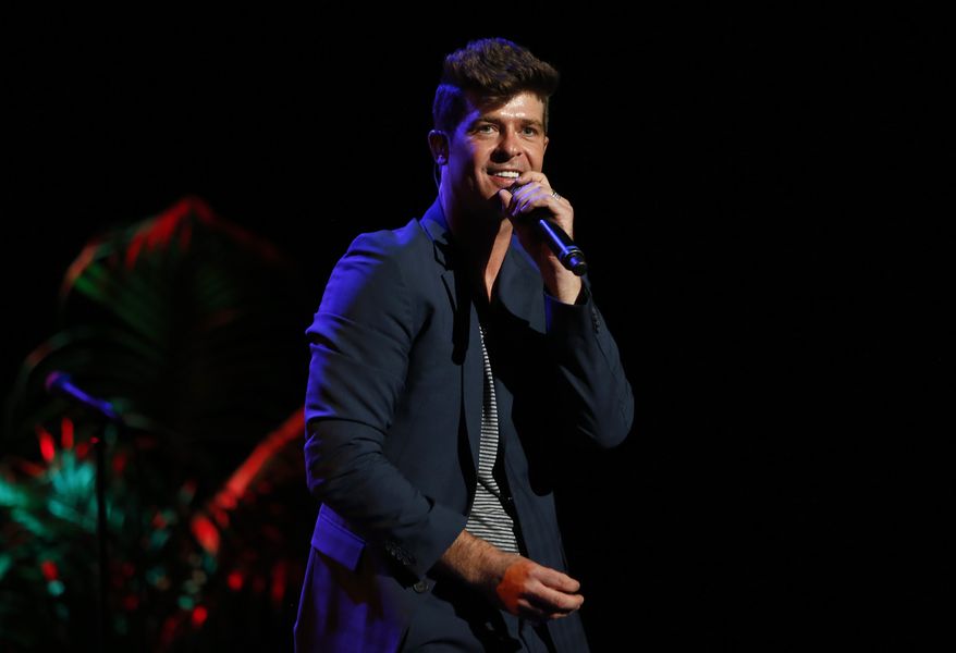 Singer Robin Thicke performs at the "Voices on Point" concert and gala in Los Angeles on Saturday, Sept. 15, 2012. (AP Photo/Point Foundation, Colin Young-Wolff)