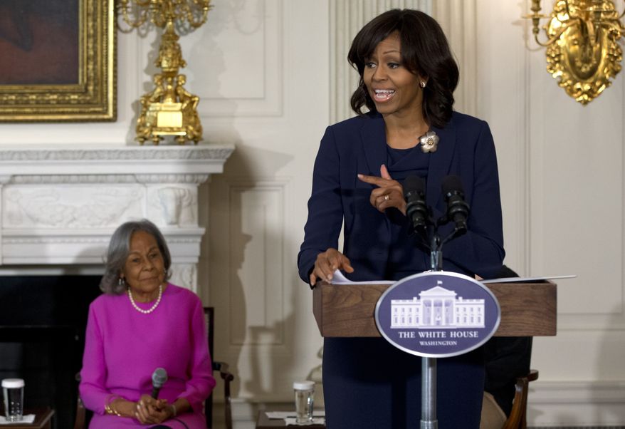 First lady Michelle Obama (right) — next to Rachel Robinson, the widow of baseball legend Jackie Robinson — introduces a panel of the cast and crew of the movie &quot;42&quot; before a workshop for high school and college students on Tuesday, April 2, 2013, in the State Dining Room of the White House in Washington. (AP Photo/Jacquelyn Martin)