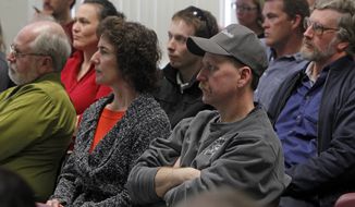 **FILE** People listen to Lindsey Tucker, Deputy Commissioner of the Department of Vermont Health Access, in Newport, Vt., as she explains the state&#39;s health care exchange program on March 20, 2013. (Associated Press)