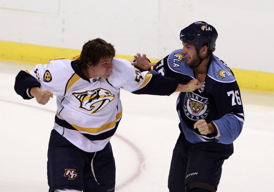 Florida Panthers right wing Anthony Luciani, right, and Nashville Predators center Michael Latta fight during the second period of the second of two preseason NHL hockey games, Monday, Sept. 19, 2011 in Sunrise, Fla. (AP Photo/Wilfredo Lee)