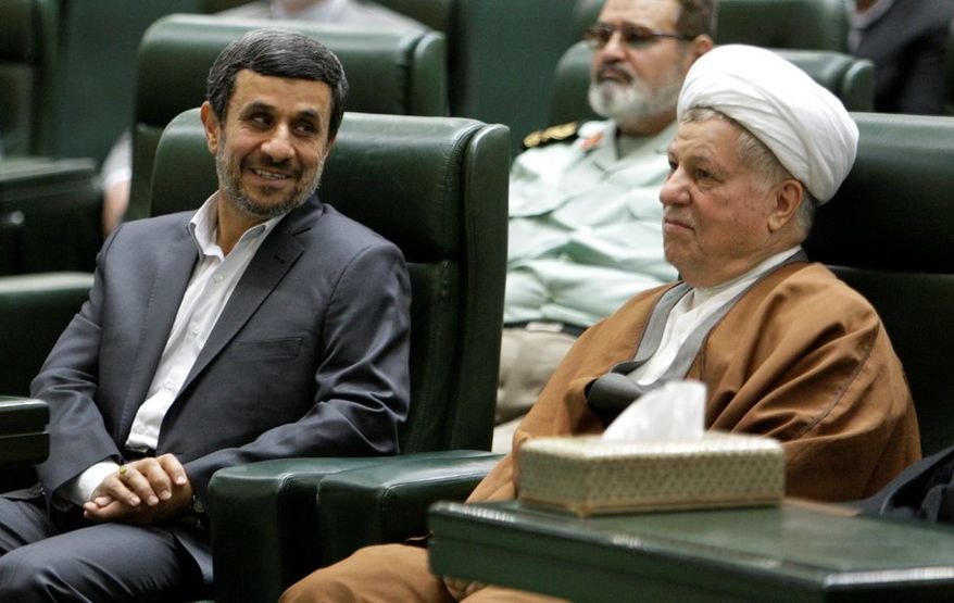 President Mahmoud Ahmadinejad (left) is not on the ballot in June's election. He is shown with supreme leader Ayatollah Ali Khamenei (center) and chief of the Expediency Council Akbar Hashemi Rafsanjani. (Associated Press)