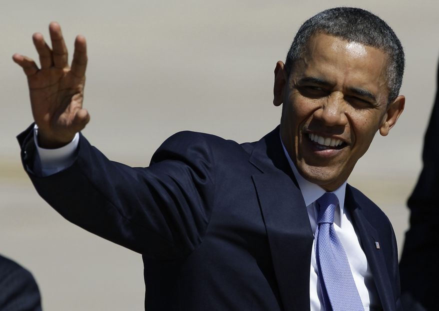 President Barack Obama waves at his arrival in Colorado for a speech on gun control. April 4, 2013. (AP Photo/Brennan Linsley)