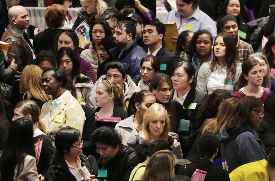 A crowd of job seekers attends a health care job fair in New York on Thursday, March 14, 2013. (AP Photo/Mark Lennihan)