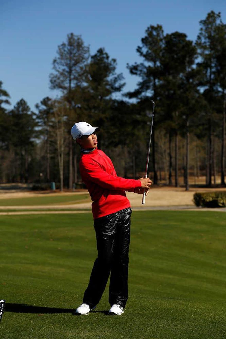 Tianlang Guan, who will be the youngest competitor in Masters history at age 14, works on his game at Champions Retreat Golf Club in Evans. (Todd Bennett / The Augusta Chronicle)
