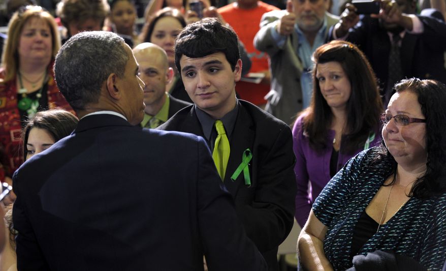 President Obama greets the family of teacher Victoria Soto, who was killed in the Newtown school shooting, including her mother, Donna Soto (right), and brother Carlos Soto (center), after his speech at the University of Hartford in Hartford, Conn., on Monday, April 8, 2013. Mr. Obama said that lawmakers have an obligation to the children killed and other victims of gun violence to act on his proposals. (AP Photo/Susan Walsh)