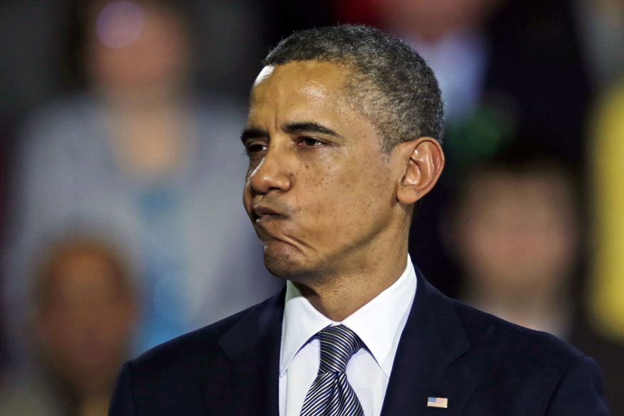 President Obama pauses during his address during a visit to the University of Hartford, in Hartford, Conn., on April 8, 2013. Obama visited the school to highlight gun control legislation and to meet with the families of victims from the Sandy Hook elementary school shootings. (Associated Press)