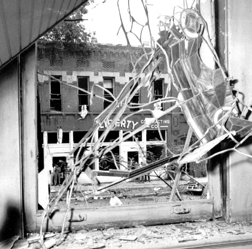 **FILE** A stained glass window in the Sixteenth Street Baptist Church is twisted and broken after a bomb blasted the building in Birmingham, Ala, in this Sept. 15, 1963 file photo. Four small black girls were killed by the blast and several were injured. (Associated Press/Birmingham News)
