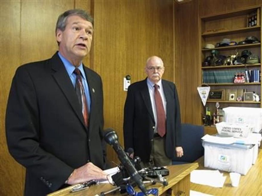 ** FILE ** North Dakota Attorney General Wayne Stenehjem, left, speaks while North Dakota Secretary of State Al Jaeger listens at a news conference on the results of an investigation into petition fraud, Tuesday, Sept. 4, 2012 in Stenehjem&#x27;s office at the Capitol in Bismarck, N.D. (Associated Press)