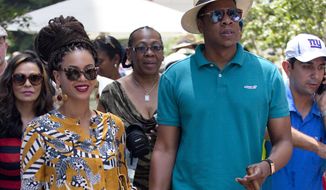 **FILE** Married musicians Beyonce (left) and Jay-Z tour Old Havana on April 4, 2013. (Associated Press)