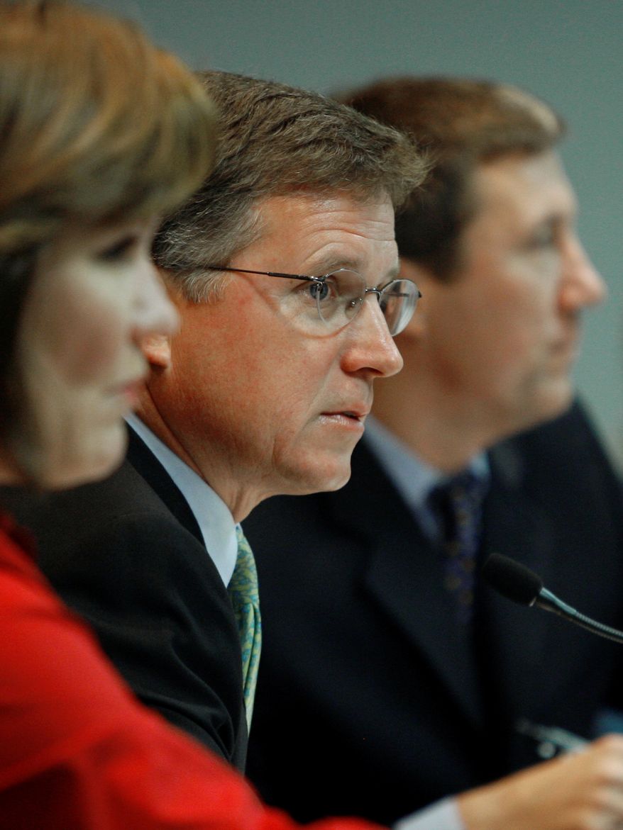 **FILE** Chairman Barry Smitherman (center) presides during a meeting of the Public Utility Commission of Texas on July 17, 2008, in Austin, Texas. (Associated Press)