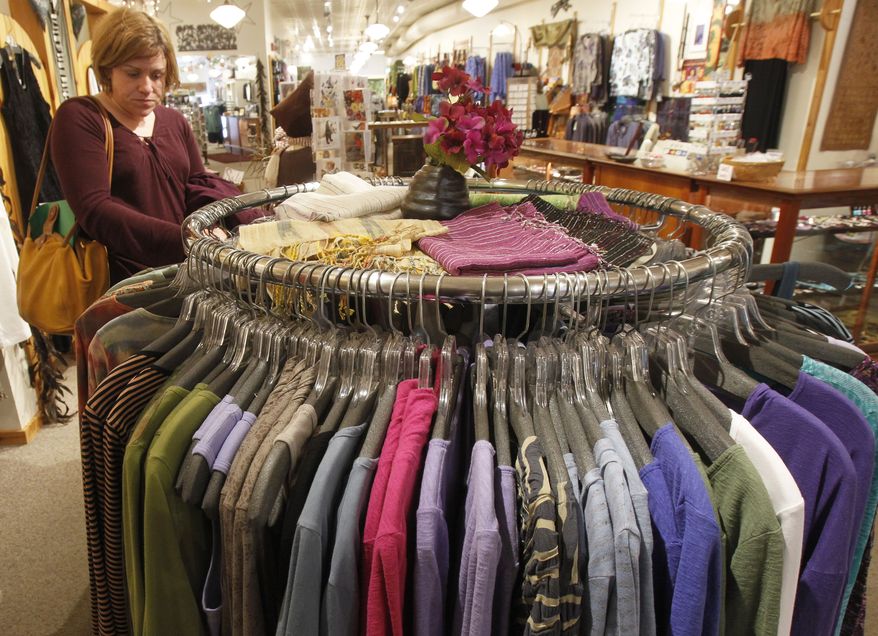 **FILE** A shopper looks over the clothes at the Vermont Trading Company in Montpelier, Vt., on Tuesday, April 9, 2013. (Associated Press)