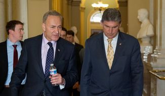 Sen. Joe Manchin III (right), West Virginia Democrat, tempered a proposal by Sen. Charles E. Schumer, New York Democrat, that would have expanded checks to virtually all private gun sales. (Associated Press)