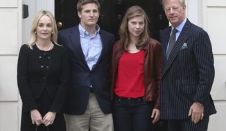 Mark Thatcher (right), the son of the late British Prime Minister Margaret Thatcher, stands with his family — (from left) wife Sarah, son Michael and daughter Amanda — outside his mother&#39;s home in London on Monday, April 15, 2013. (AP Photo/Steve Parsons, Press Association)