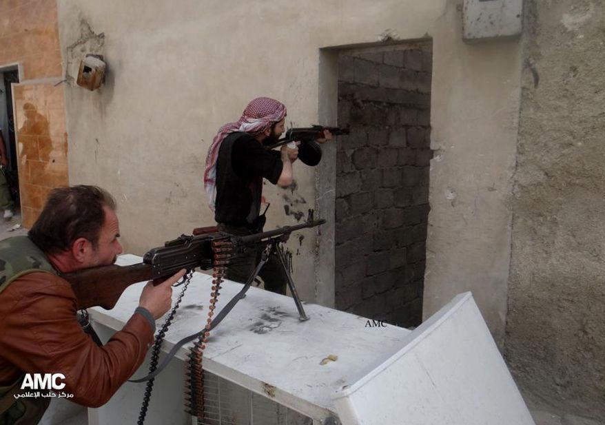 Free Syrian Army fighters take their position during a battle with Syrian government forces in Aleppo, Syria, on In on Saturday, April 13, 2013, in this citizen journalist image provided by Aleppo Media Center and authenticated based on its contents and other AP reporting. Activists say government warplanes have carried out airstrikes around the country. (AP Photo/Aleppo Media Center)