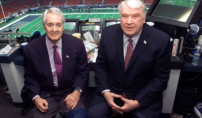 **FILE** Pat Summerall and John Madden in the FOX broadcast booth before the NFC divisional playoff in this Jan. 20, 2002 photo in St. Louis. (AP Photo/Michael Conroy)