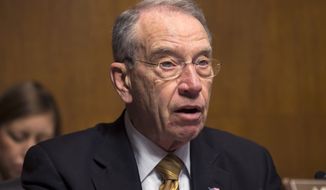 **FILE** Sen. Chuck Grassley, Iowa Republican, speaks during a Senate Judiciary Committee hearing on immigrant women and immigration reform on Capitol Hill in Washington on March 18, 2013. (Associated Press)