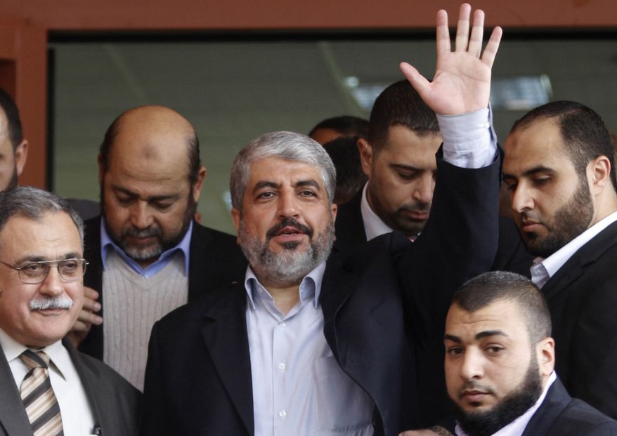 ** FILE ** In this Dec. 9, 2012, file photo, Hamas leader Khaled Mashaal waves during his visit to the Islamic University in Gaza City. (AP Photo/Hatem Moussa, File)