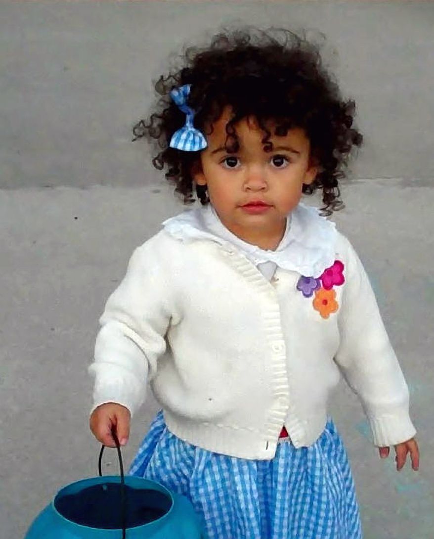 Matt and Melanie Capobianco's adoptive daughter, Veronica, goes trick-or-treating in Charleston, S.C., in October 2011. The girl is at the center of a case before the U.S. Supreme Court challenging a federal law on the adoption of American Indian children. (AP Photo/Courtesy of Melanie Capobianco)