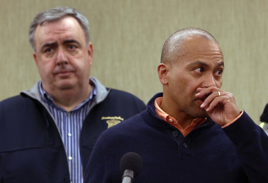 ** FILE ** Massachusetts Gov. Deval Patrick pauses as he speaks about the explosions during a news conference as Boston Police Commissioner Edward Davis, left, looks on, Monday, April 15, 2013, in Boston. Two explosions shattered the finish of the Boston Marathon. (AP Photo/Bizuayehu Tesfaye)