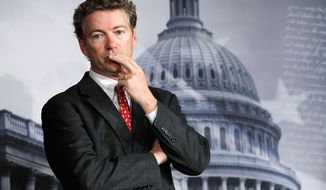 Sen. Rand Paul, Kentucky Republican, said he is still torn on what to do with some of the enemy combatants in the war on terrorism captured overseas the U.S. holds. His father, Ron Paul, advocates closing the Guantanamo Bay prison. (Associated Press)