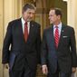 ** FILE ** Sens. Joe Manchin III (left), West Virginia Democrat, and Patrick J. Toomey, Pennsylvania Republican, arrive on Wednesday, April 10, 2013, for a news conference on Capitol Hill in Washington to announce that they have reached a bipartisan deal on expanding background checks to more gun buyers. (Associated Press)