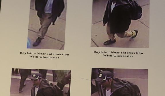 Photos of one of two suspects sought in the Boston Marathon bombing is displayed during a news conference talking about the investigation of the Boston Marathon explosions on April 18, 2013, in Boston. (Associated Press)