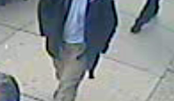 This image released by the FBI on Thursday, April 18, 2013, shows in a image from video what the FBI is calling suspect number 1 with a black hat walking with a backpack in Boston on Monday, April 15, 2013, before the explosions at the Boston Marathon. (AP Photo/FBI)