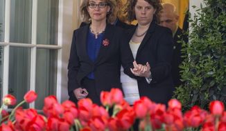 Former Rep. Gabby Giffords is helped as she arrives for a news conference in the Rose Garden of the White House, Wednesday, April 17, 2013, in Washington, about measures to reduce gun violence and the bill to expand background checks on guns that was defeated in the Senate. (AP Photo/Carolyn Kaster)