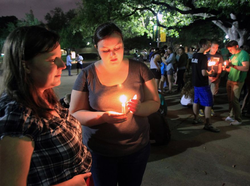 Baylor University students hold a candlelight vigil outside Waco Hall for the victims of the West, Texas, fertilizer plant explosion on April 17, 2013. (Associated Press/Waco Tribune Herald)