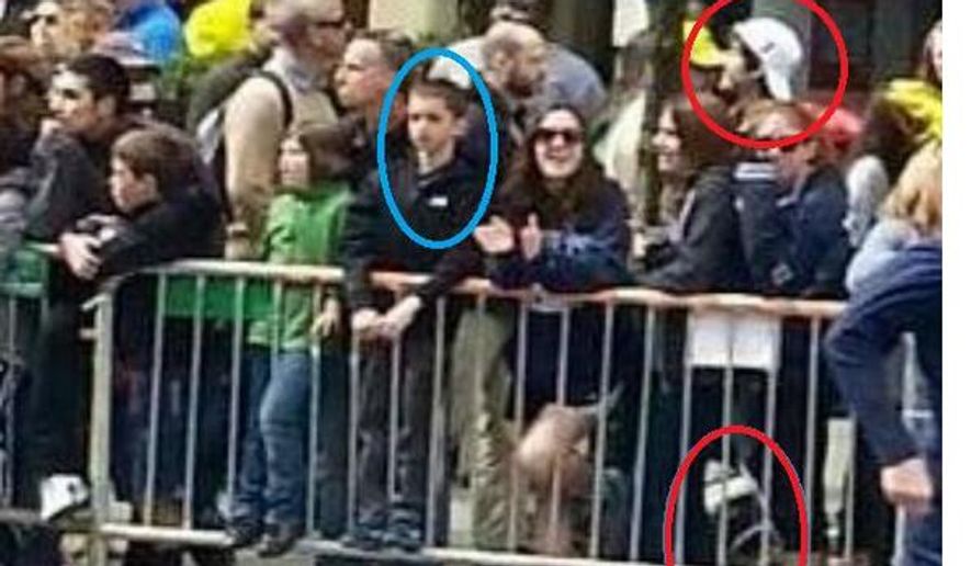 This photograph, taken from a surveillance camera in Boston and posted on Twitter, shows one of the suspects of the Boston Marathon bombing in the same frame with a boy who appears to be 8-year-old Martin Richard, who was killed in one of the blasts. The circle at bottom right appears to be a backpack or a package. (Credit: Twitter)
