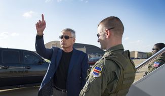 Secretary of Defense Chuck Hagel gestures before boarding an aircraft at Andrews Air Force Base in Washington&#39;s Maryland suburbs on Saturday, April 20, 2013, for a trip to the Middle East. (AP Photo/Jim Watson, Pool)