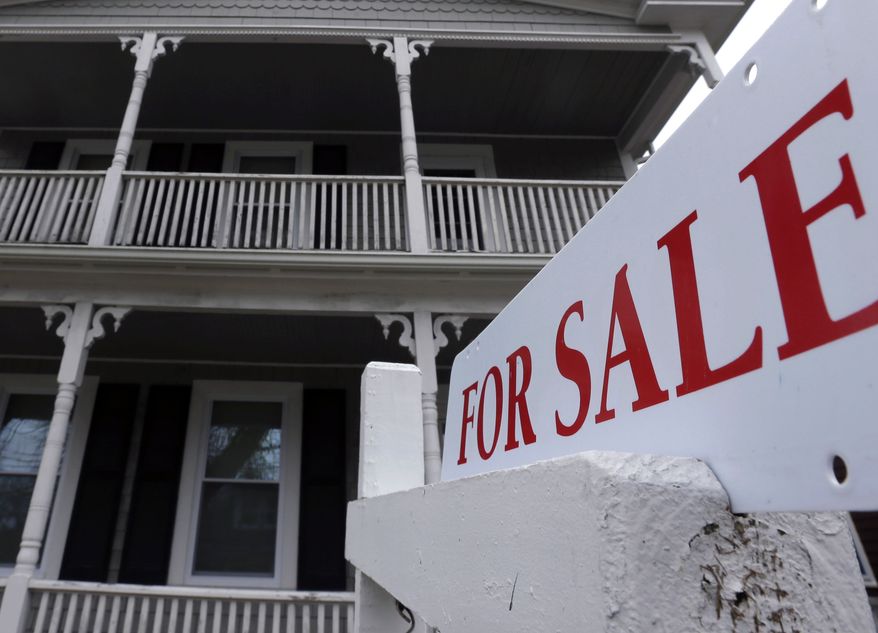 A "for sale" sign hangs in front of a house in Plymouth, Mass., on Tuesday, March 5, 2013. Sales of previously occupied homes dipped in March as the supply remained tight. (AP Photo/Steven Senne)