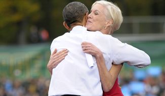 **FILE** President Obama hugs Cecile Richards, president of the Planned Parenthood Action Fund, after she introduced the president at a campaign event where he spoke about choice facing women in the election rally at George Mason University in Fairfax, Va., on Oct. 19, 2012. (Associated Press)