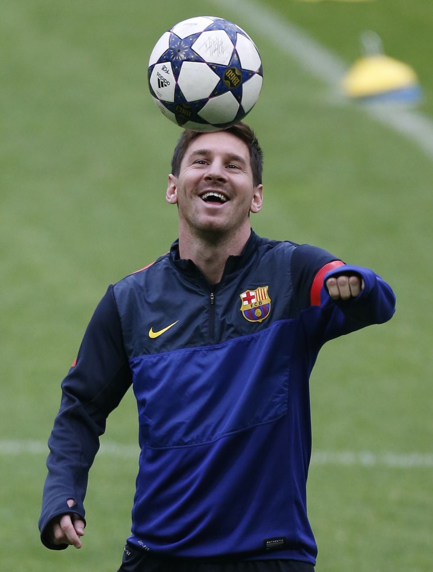 Barcelona's Lionel Messi laughs during a training session in Munich, southern Germany, on Monday, April 22, 2013. Bayern Munich will face FC Barcelona in a first leg Champions League semi final soccer match on Tuesday. (AP Photo/Matthias Schrader)