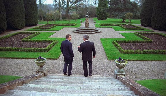 President George W. Bush and Prime Minister Tony Blair of Great Britain walk on the grounds of Hillsborough Castle Monday, April 7, 2003, in Hillsborough, Northern Ireland. Photographs by Eric Draper from Front Row Seat: A Photographic Portrait of the Presidency of George W. Bush(Copyright &amp;#194;&amp;#169; 2013). For more information visit www.utexaspress.com