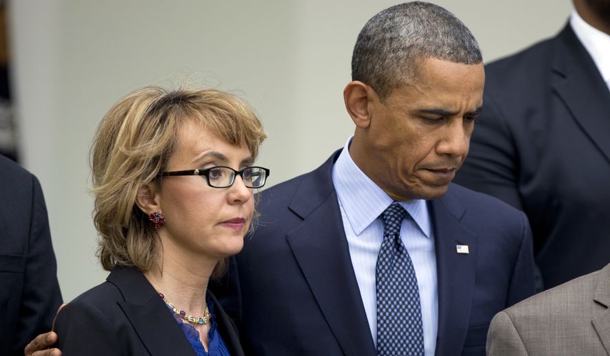 President Obama puts his arm around former Rep. Gabrielle Giffords, Arizona Democrat, before he speaks in the Rose Garden at the White House in Washington on April 17, 2013, about measures to reduce gun violence. (Associated Press) **FILE** 