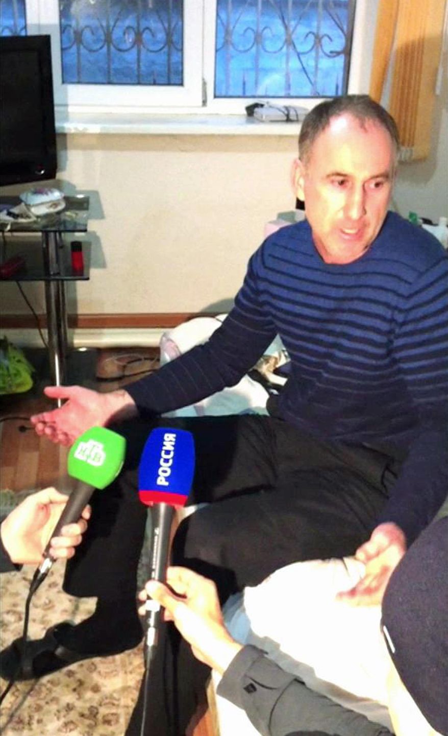 In this image taken from a mobile phone video, the father of USA Boston bomb suspects, Anzor Tsarnaev reacts as he talks to the media about his sons, in his home in the Russian city of Makhachkala, Friday April 19, 2013. One son is now dead, and one son Dzhokhar Tsarnaev is in police custody. (AP Photo)