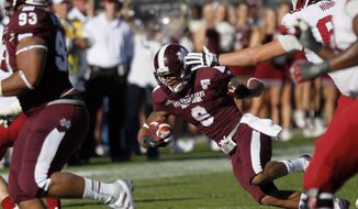 Mississippi State defensive back Darius Slay (9) loses his balance as he runs back a fourth quarter interception for 15-yards against Arkansas in an NCAA college football game in Starkville, Miss., Saturday, Nov. 17, 2012. Mississippi State won 45-14. (AP Photo/Rogelio V. Solis)