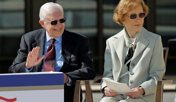 Former president Jimmy Carter and his wife, former first lady Rosalynn Carter arrive for the dedication of the George W. Bush Presidential Center, Thursday, April 25, 2013, in Dallas. (AP Photo/David J. Phillip)