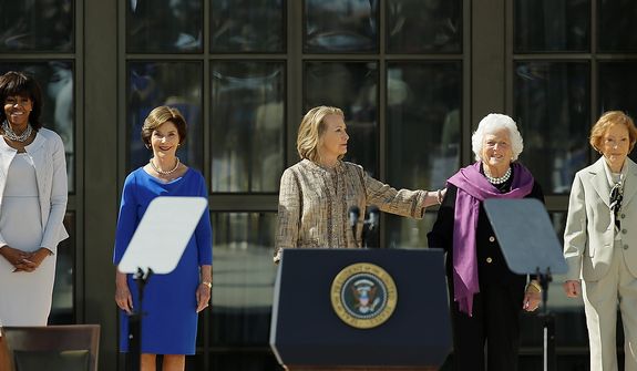 From left, First Lady Michelle Obama, former first lady Laura Bush, former first lady Hillary Clinton, former first lady Barbara Bush and former first lady Rosalynn Carter arrive for the dedication of the George W. Bush Presidential Center Thursday, April 25, 2013, in Dallas. (AP Photo/David J. Phillip) 